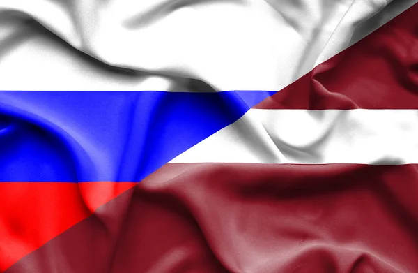 Bandeira ondulada da Letónia e da Rússia — Fotografia de Stock