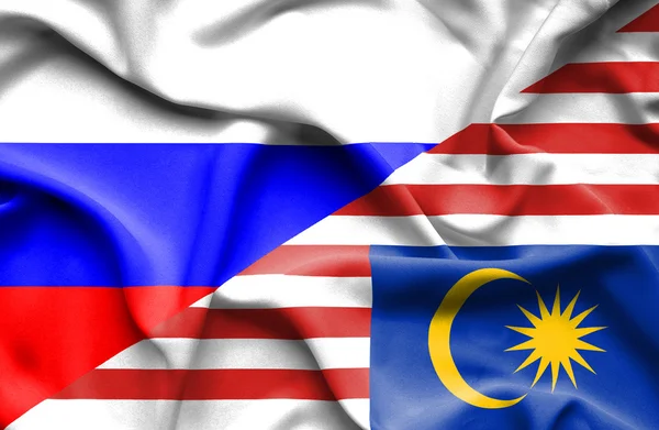 Malezya ve Rusya bayrağı sallayarak — Stok fotoğraf