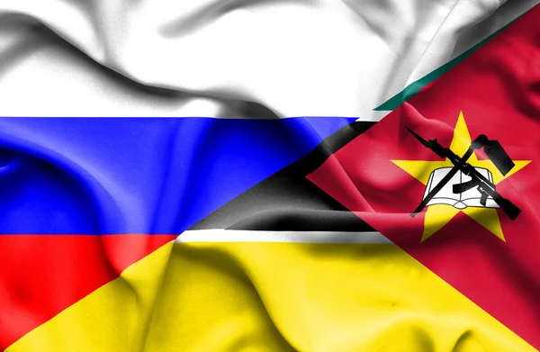 Waving flag of Mozambique and Russia — Stock Photo, Image