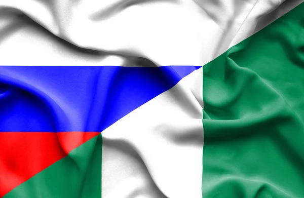 Ondeando la bandera de Nigeria y Rusia — Foto de Stock