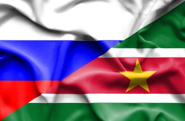 Surinam ve Rusya bayrağı sallayarak