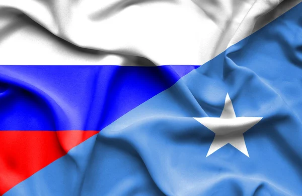 Waving flag of Somalia and Russia — Stock Photo, Image