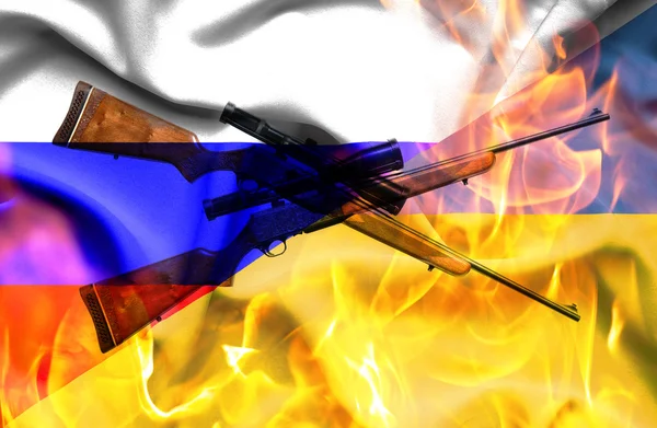Розмахуючи прапором України та Росії у полум'я з гвинтівки — стокове фото