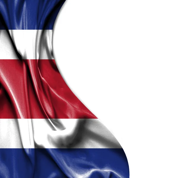 Costa Rica ondeando bandera de satén aislada sobre fondo blanco — Foto de Stock
