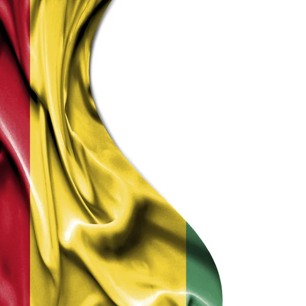 Guinea waving satin flag isolated on white background — Stock Photo, Image
