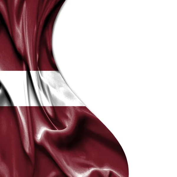 Латвия размахивает атласным флагом на белом фоне — стоковое фото