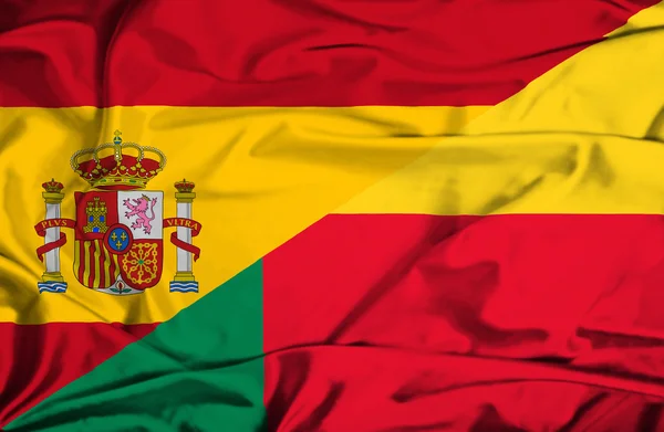 Waving flag of Benin and Spain — Stock Photo, Image