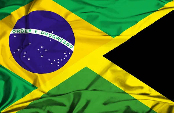 Acenando bandeira da Jamaica e — Fotografia de Stock