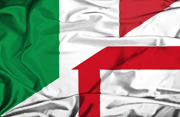 飘扬的英格兰和意大利国旗 — 图库照片