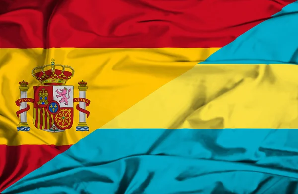 Waving flag of Bahamas and Spain — Stock Photo, Image