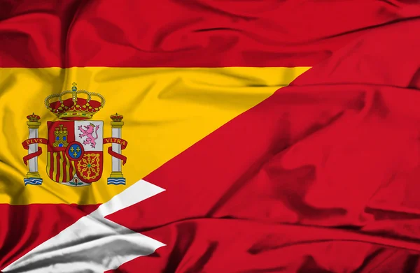 Waving flag of Bahrain and Spain — Stock Photo, Image