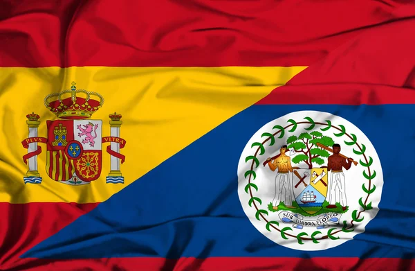 Vlající vlajka belize a Španělsko — Stock fotografie