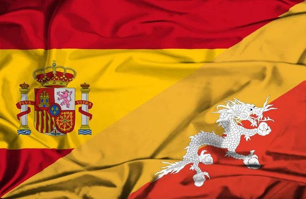 Waving flag of Bhutan and Spain — Stock Photo, Image