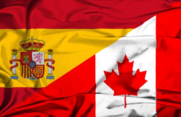 Vlající vlajka Kanada a Španělsko — Stock fotografie