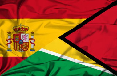 guyana ve İspanya bayrağı sallayarak