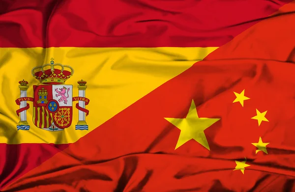 A Kína és Spanyolország lobogója hullámzó — Stock Fotó