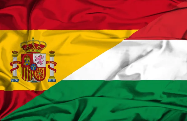 Waving flag of Hungary and Spain — Stock Photo, Image