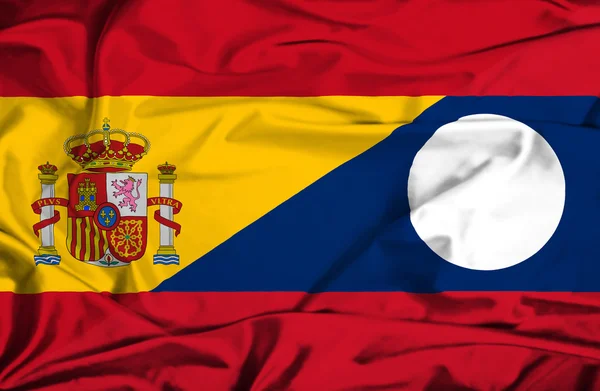 Waving flag of Laos and Spain — Stock Photo, Image