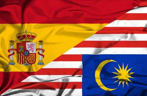 Waving flag of Malaysia and Spain — Stock Photo, Image