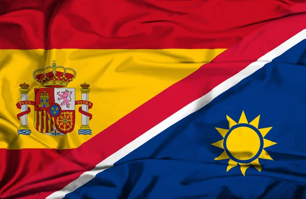 Waving flag of Namibia and Spain — Stock Photo, Image