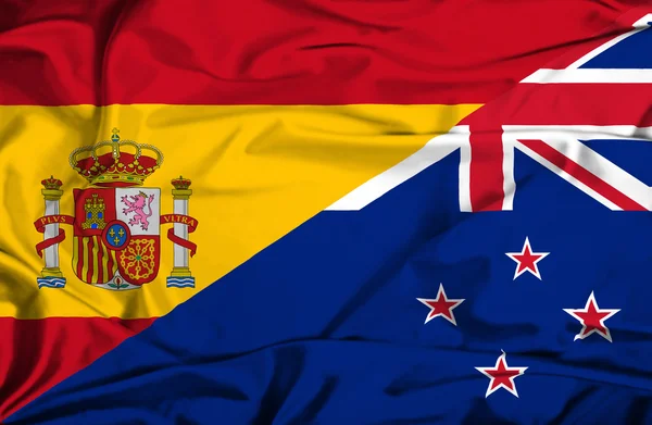 Waving flag of New Zealand and Spain — Stock Photo, Image