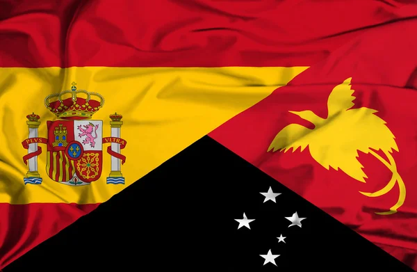 Waving flag of Papua New Guinea and Spain — Stock Photo, Image