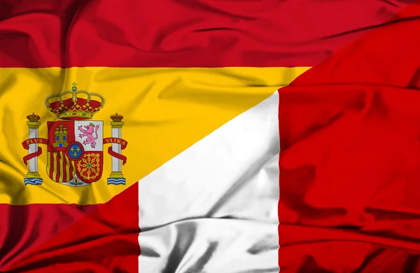 Machać flaga peru i Hiszpania — Zdjęcie stockowe