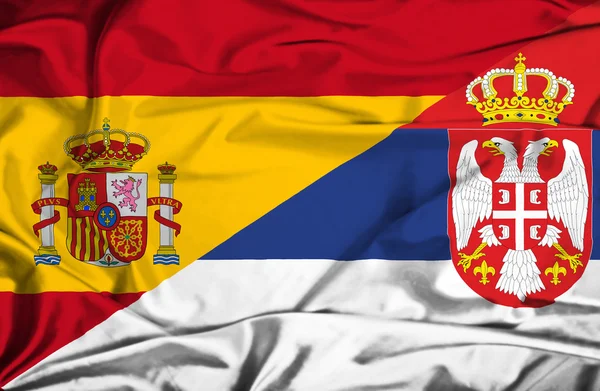 Waving flag of Serbia and Spain — Stock Photo, Image