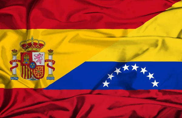 Waving flag of Venezuela and Spain — Stock Photo, Image