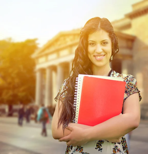 Portrait of happy student girl against street background — Stock Photo, Image