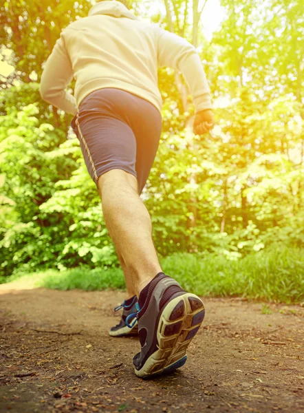 Runner feet running on road closeup on shoe — Stock Photo, Image