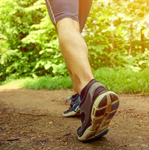 Runner feet running on road closeup on shoe — Stock Photo, Image