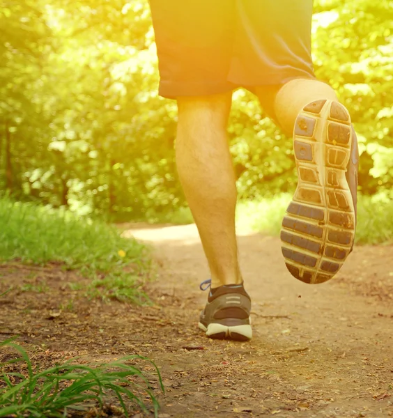 Runner feet running on road closeup on shoe — Stock Photo, Image