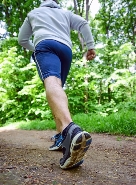 Runner feet running on road closeup on shoe — Stock Photo, Image