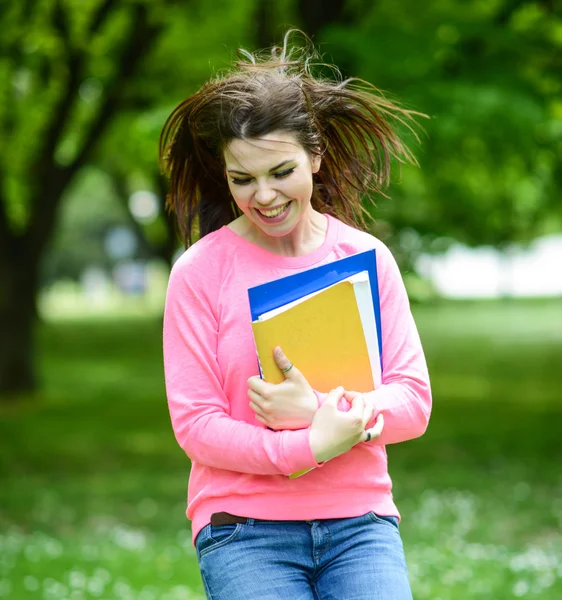 Happy student girl jumping for joy after passed exam — Stock Photo, Image