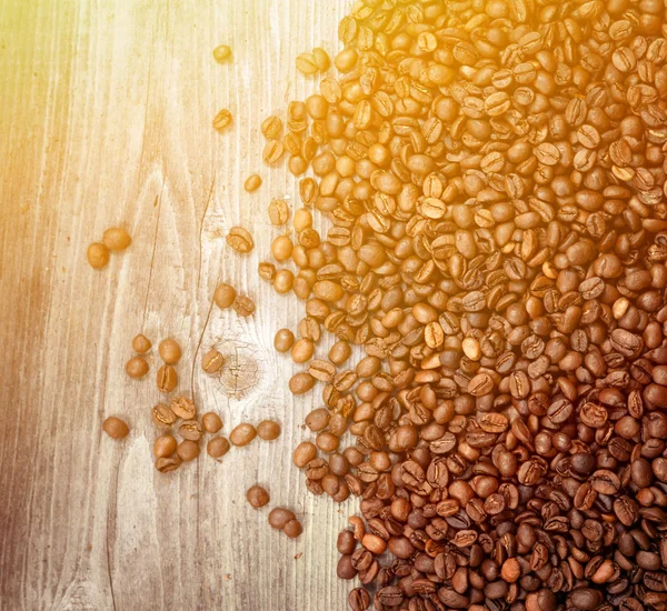 Coffee beans on wooden background — Stock Photo, Image