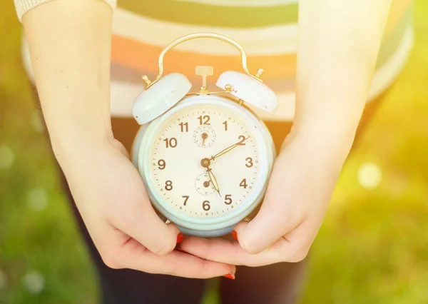 Hands holding old clock — Stock Photo, Image