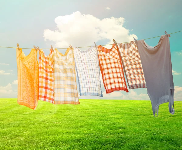 Laundry hanging over vivid landscape — Stock Photo, Image