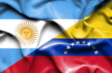 Venezuela ve Arjantin bayrağı sallayarak