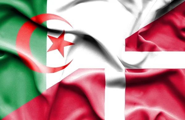 Waving flag of Denmark and Algeria — Stock Photo, Image