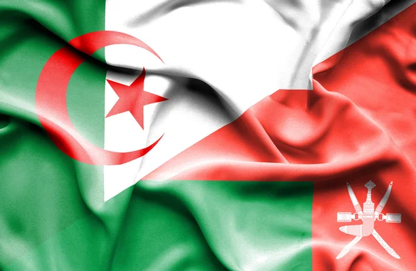 Vlající vlajka Ománu a Alžírsko — Stock fotografie