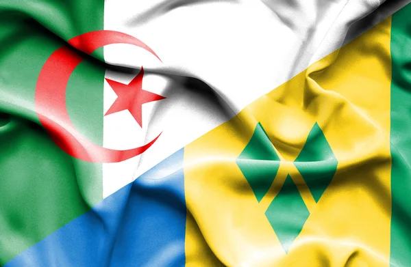 Wapperende vlag van Saint Vincent en Grenadines en Algerije — Stockfoto