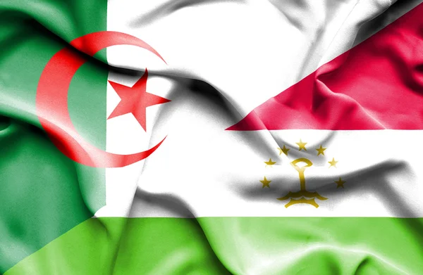 Wapperende vlag van Tadzjikistan en Algerije — Stockfoto