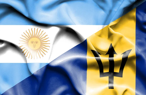 Mávání vlajkou Barbadosu a Argentina — Stock fotografie