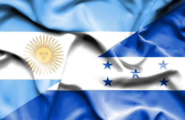 Waving flag of Honduras and Argentina — Stock Photo, Image