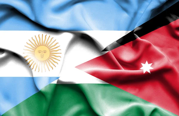 Jordan ve Arjantin bayrağı sallayarak — Stok fotoğraf
