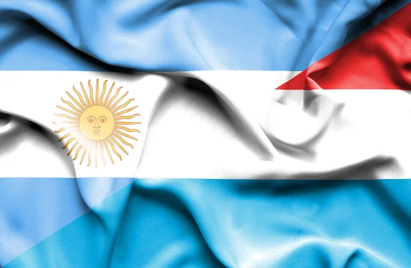 Waving flag of Luxembourg and Argentina — Stock Photo, Image