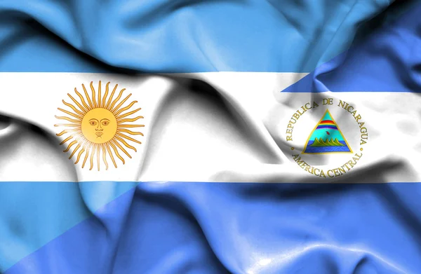 Waving flag of Nicaragua and Argentina — Stock Photo, Image