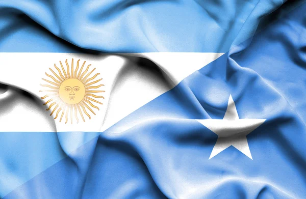 Waving flag of Somalia and Argentina — Stock Photo, Image