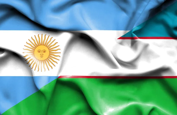 Wapperende vlag van Oezbekistan en Argentinië — Stockfoto